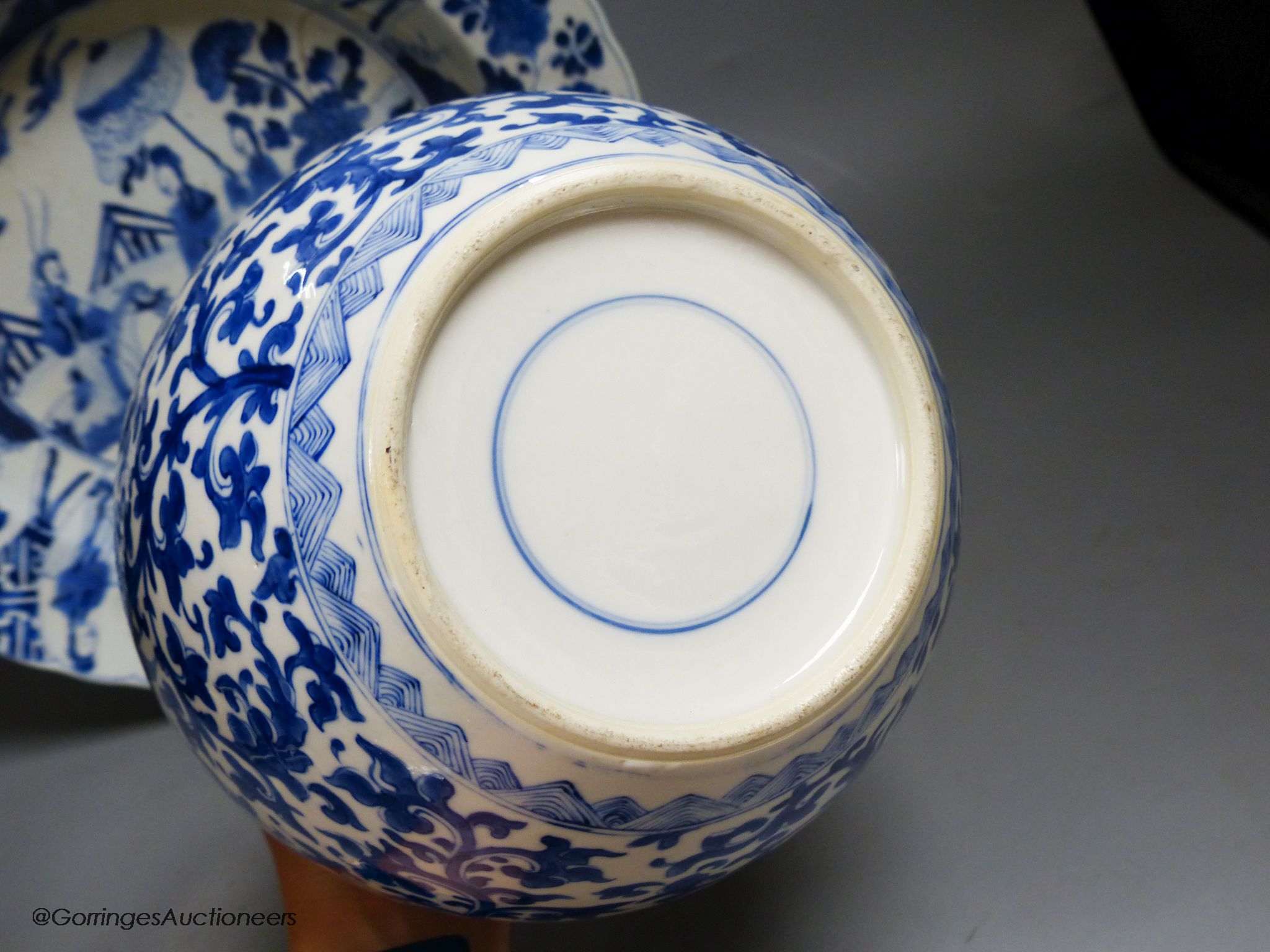 A Chinese blue and white dish, Kangxi mark and of the period, diameter 34cm, and a 19th century Chinese blue and white jar